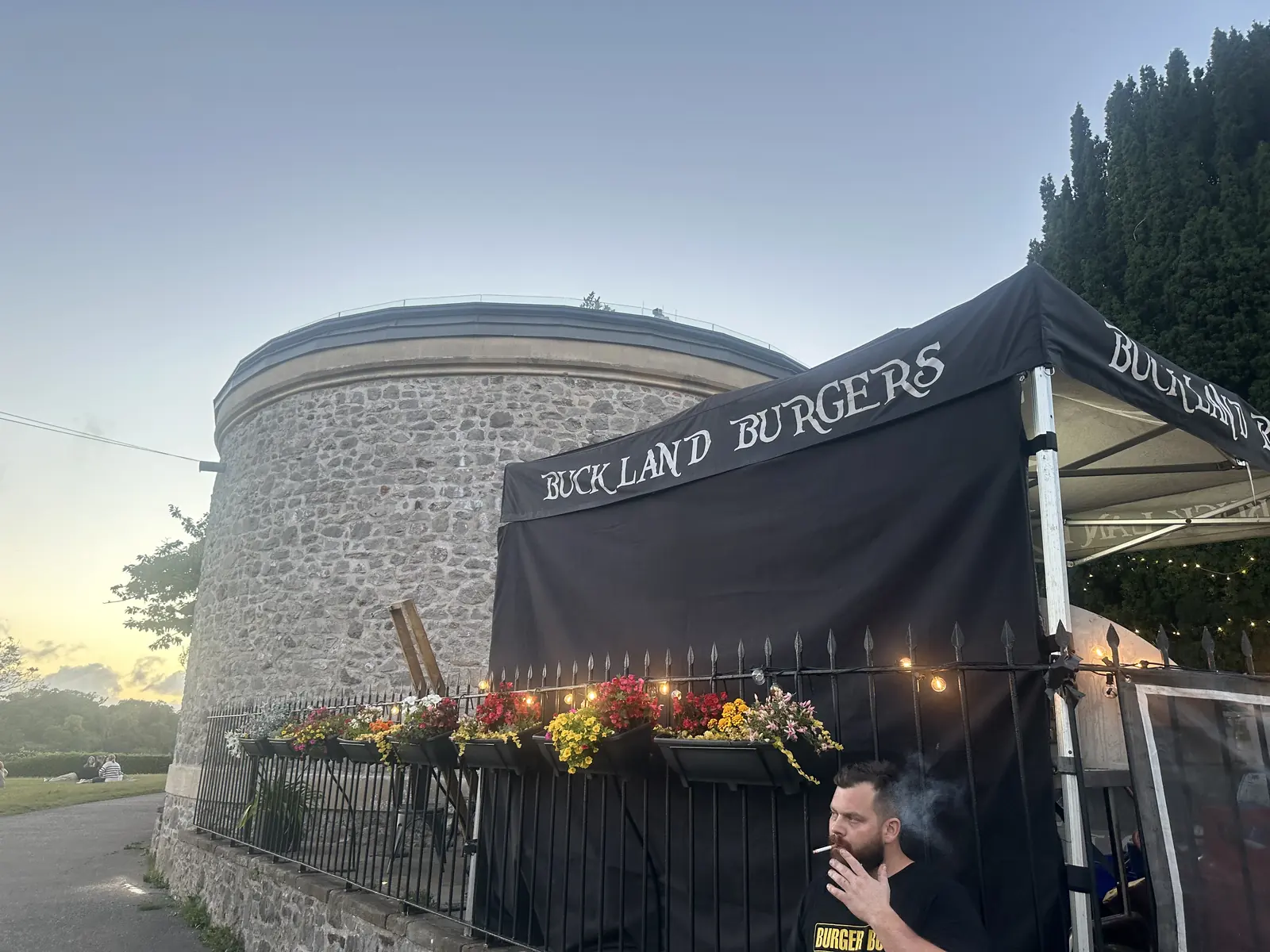 Buckland Burgers stall serving at an evening event