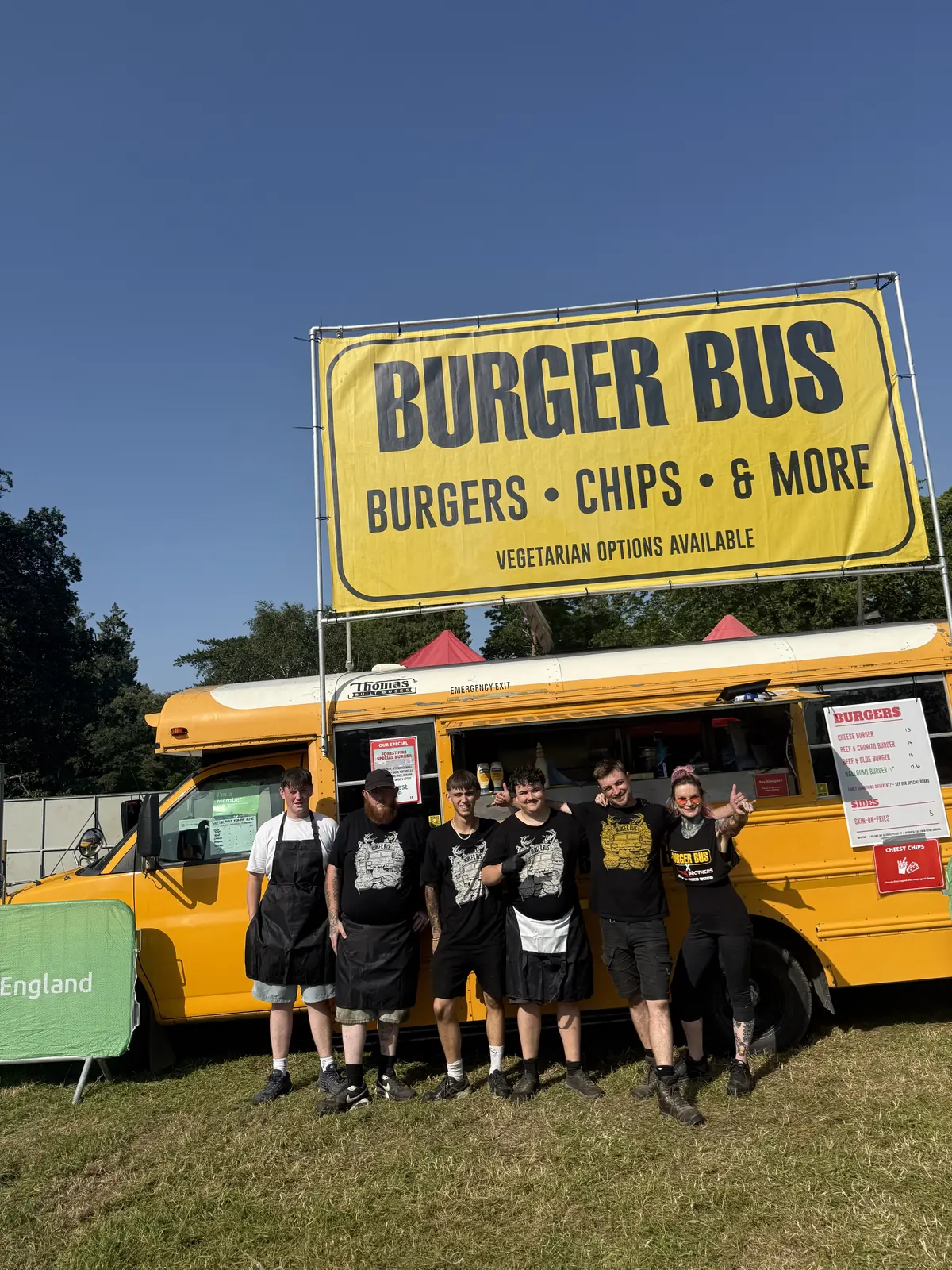 The Street Food Steve team in front of Burger Bus at a summer festival