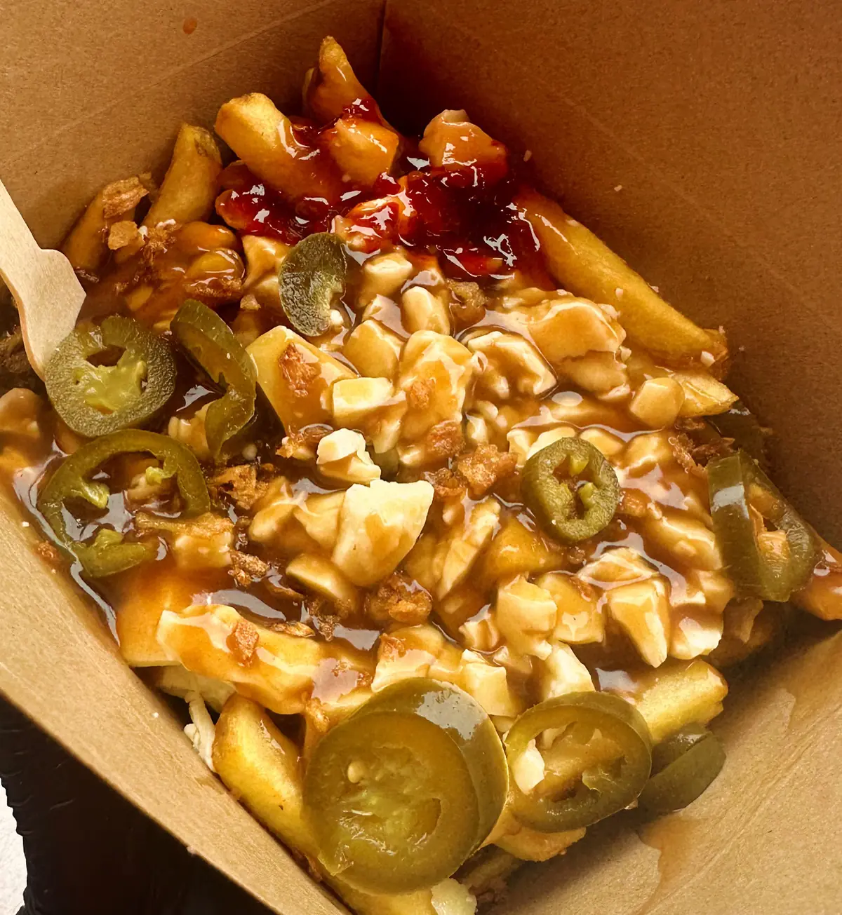 Loaded poutine from Poutine Brothers with cheese curds, gravy and jalapeños