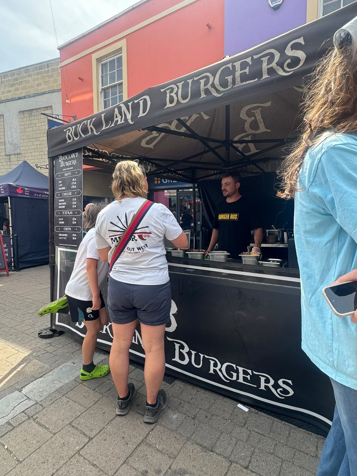 Buckland Burgers serving customers at a market